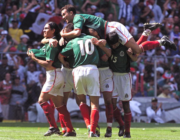 Francisco Palencia (L) of Mexico and teammates cel