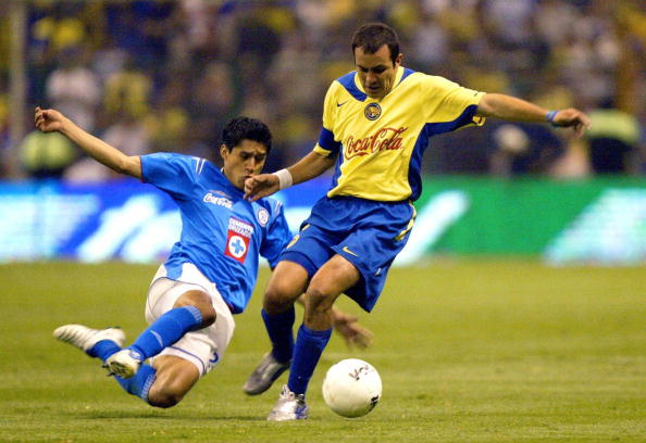 Cuauhtemoc Blanco (R) of America fights