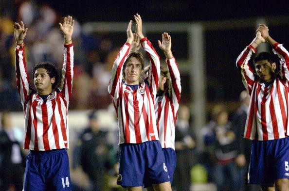Chivas of Guadalajara's players wave to